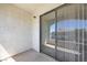View of a balcony with sliding glass door and textured wall at 950 Seven Hills Dr # 1624, Henderson, NV 89052