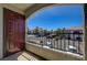 View from balcony with metal railing overlooking parking and neighborhood buildings on a sunny day at 950 Seven Hills Dr # 1624, Henderson, NV 89052