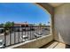 View from balcony of the parking lot and neighborhood with metal railing on a sunny day at 950 Seven Hills Dr # 1624, Henderson, NV 89052