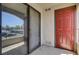 Balcony with sliding glass door, exterior door, and textured walls at 950 Seven Hills Dr # 1624, Henderson, NV 89052