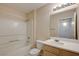 Bathroom with bath tub, mirror, vanity, and updated fixtures at 950 Seven Hills Dr # 1624, Henderson, NV 89052