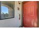 Close-up of the unit entrance highlighting the vibrant red door and unit number 1624 at 950 Seven Hills Dr # 1624, Henderson, NV 89052