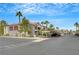 Exterior view of apartments and covered parking spots on a sunny day at 950 Seven Hills Dr # 1624, Henderson, NV 89052