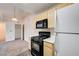 Bright kitchen featuring wooden cabinets, modern appliances, and an adjacent dining area at 950 Seven Hills Dr # 1624, Henderson, NV 89052