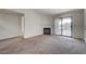 Inviting living room with fireplace, carpet floors, and sliding doors to the outdoor balcony at 950 Seven Hills Dr # 1624, Henderson, NV 89052