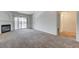 Comfortable living room with fireplace, carpet flooring, and a sliding door at 950 Seven Hills Dr # 1624, Henderson, NV 89052