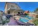 Enjoy the backyard with covered patio, pool, spa, and well-maintained landscaping at 1025 Clover Tip Ct, Las Vegas, NV 89123