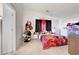 Bright bedroom featuring a bold red and black theme, with unique decorations and ample storage at 1025 Clover Tip Ct, Las Vegas, NV 89123