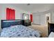 Bright bedroom with a black headboard bed and dark wood dresser at 1025 Clover Tip Ct, Las Vegas, NV 89123