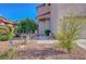 Charming front entrance featuring desert landscaping, a stone walkway, and a secure front door at 1025 Clover Tip Ct, Las Vegas, NV 89123