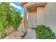 Close-up of the front entrance with desert landscaping and a secure, gated front door at 1025 Clover Tip Ct, Las Vegas, NV 89123