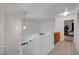 Hallway with wood floors, built in storage, and access to bedrooms at 1025 Clover Tip Ct, Las Vegas, NV 89123