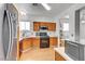 Well-equipped kitchen featuring wood cabinets and stainless steel appliances at 1025 Clover Tip Ct, Las Vegas, NV 89123