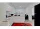Compact kitchen with white cabinets, marble countertops, and modern appliances at 1025 Clover Tip Ct, Las Vegas, NV 89123