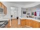 Charming kitchen with wood cabinets offering ample counter space and natural light at 1025 Clover Tip Ct, Las Vegas, NV 89123
