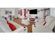 Open-concept living room with wood floors and comfortable white seating at 1025 Clover Tip Ct, Las Vegas, NV 89123