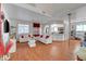 Spacious living room featuring wood floors and white sofas, great for entertaining guests at 1025 Clover Tip Ct, Las Vegas, NV 89123