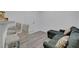 Living room with gray sectional sofa, bar top and three barstools at 1025 Clover Tip Ct, Las Vegas, NV 89123