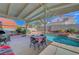 A well-kept backyard and inground pool with patio and lush landscaping offers a serene outdoor retreat at 1025 Clover Tip Ct, Las Vegas, NV 89123