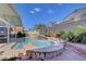 The backyard boasts a sparkling pool and spa, perfect for outdoor entertaining and relaxation at 1025 Clover Tip Ct, Las Vegas, NV 89123