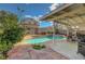 Beautiful pool area with spa, stone landscaping, and covered patio is an outdoor oasis at 1025 Clover Tip Ct, Las Vegas, NV 89123