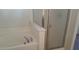 Bathroom featuring tub and glass doors at 10371 Calypso Cave St, Las Vegas, NV 89141