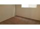 Cozy bedroom with soft carpeting and a bright window, perfect for relaxation at 10371 Calypso Cave St, Las Vegas, NV 89141