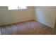 Bedroom featuring standard window and beige carpet at 10371 Calypso Cave St, Las Vegas, NV 89141