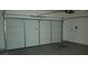 View of the garage with white automatic door at 10371 Calypso Cave St, Las Vegas, NV 89141