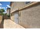 Enclosed backyard patio with tiled flooring and a secure gate for privacy and relaxation at 1069 Coronado Peak Ave, Las Vegas, NV 89183