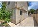 Backyard view with patio, stucco exterior, garden beds, and partial fencing at 1069 Coronado Peak Ave, Las Vegas, NV 89183