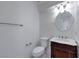 Stylish half bathroom with vintage vanity, decorative mirror, and modern fixtures at 1069 Coronado Peak Ave, Las Vegas, NV 89183