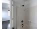 Tiled shower and tub in a bathroom with a shower head fixture at 1069 Coronado Peak Ave, Las Vegas, NV 89183
