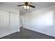 Bedroom with a ceiling fan, wood-look floors, and closet doors at 1069 Coronado Peak Ave, Las Vegas, NV 89183