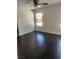Bedroom with a ceiling fan, hardwood floors, base trim, neutral paint, and a window with wood blinds at 1069 Coronado Peak Ave, Las Vegas, NV 89183