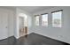 Bedroom featuring wood-look flooring, an entryway, and natural light at 1069 Coronado Peak Ave, Las Vegas, NV 89183