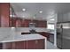 Well-lit kitchen featuring stainless steel appliances, ample counter space, and modern cabinets at 1069 Coronado Peak Ave, Las Vegas, NV 89183