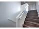 A stairway with wood steps and a white handrail provides access to the home's upper level at 1069 Coronado Peak Ave, Las Vegas, NV 89183