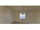 Inviting living room featuring a decorative light fixture and bright window for natural light at 1301 Madison Ave, Las Vegas, NV 89106