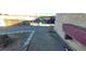 Side yard with gravel landscaping and a view of neighboring houses and parked cars at 1301 Madison Ave, Las Vegas, NV 89106