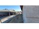Side view of house, and adjacent carport with parked vehicles at 1301 Madison Ave, Las Vegas, NV 89106