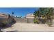 Large backyard featuring a block wall and simple landscaping under a clear blue sky at 1325 Fiesta Grande Ct, North Las Vegas, NV 89031