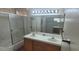 Practical bathroom featuring a double sink vanity and shower-tub at 1325 Fiesta Grande Ct, North Las Vegas, NV 89031