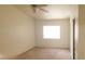 Empty bedroom with standard closet, ceiling fan, and a bright window at 1325 Fiesta Grande Ct, North Las Vegas, NV 89031
