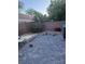 Backyard has a paved patio, a block wall, mature trees, and some playground equipment at 1355 Grass Creek Ave # 1, Henderson, NV 89012