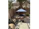 Outdoor living space with patio, palm tree, and outdoor kitchen at 1355 Grass Creek Ave # 1, Henderson, NV 89012