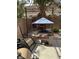 Backyard seating area with custom stone work and covered table at 1355 Grass Creek Ave # 1, Henderson, NV 89012