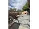 Wide backyard view featuring a brick-paved patio, sandbox, and play equipment at 1355 Grass Creek Ave # 1, Henderson, NV 89012