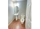 Cozy bathroom featuring a pedestal sink, toilet, and a neutral color scheme at 1355 Grass Creek Ave # 1, Henderson, NV 89012