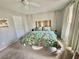 Cozy bedroom showcases a unique wooden headboard and charming floral bedding at 1355 Grass Creek Ave # 1, Henderson, NV 89012
